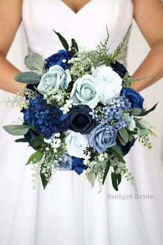 a bridal holding a bouquet of blue and white flowers