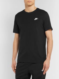 This T-shirt features a small Nike logo embroidered on the chest and no other embellishment, so it's great for layering under zip-up hoodies or open button-downs. It's cut from soft cotton-jersey that's a bit thicker, so it'll stand up well to plenty of wash and wear. Nike Collection, Black Sportswear, Club Logo, Nike Sweatpants, Plain Tshirt, Nike Hoodie, Zip Up Hoodies, T Shirt For Men, Nike Sportswear