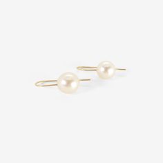 Details Rosanne Pugliese 18k yellow gold & cream-colored South Sea pearl earrings on minimalist ear wires. The pearls measure 7/16" x 7/16"(11mm) & the earrings measure approximately 1″ from the top of the minimalist ear wire to the bottom of the pearl. - 7/16" (8mm) diameter South Sea pearls - 18k yellow gold - 1" total length - each earring weighs 2.61g South Sea Pearls Earrings, Sea Pearl, Gold Cream, South Seas, Sea Pearls, South Sea Pearls, The Pearl, 22k Gold, Ear Wire