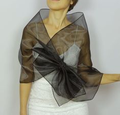 Black organza shawl, Shoulder wrap scarf, Mesh evening dress topper, Pull through mother of the bride stole, Hands free formal cover upIt's made with black organza fabric.A detail is added to be able to use it "hands-free".Rectangular shaped, it measures approximately 18.5’’x56.7’’ (47x144 cm)Size: SWith its elegant and refined look, it can be worn during the day at the office or at a cocktail reception etc.For more similar wedding & evening cover-ups, please kindly visithttps://www.etsy.com Sheer Shawl For Evening, Formal Organza Shawl, Fitted Black Shawl For Wedding, Elegant Black Shawl For Wedding, Elegant Organza Shawl For Evening, Elegant Black Wedding Shawl, Elegant Sheer Shawl For Parties, Elegant Sheer Shawl For Evening, Elegant Sheer Shawl For Wedding