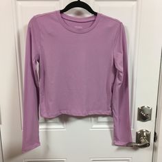 Wild Fable Long Sleeve Cropped T-Shirt Nwt Color = Lilac Streak Choose Size Measurements Approx Size Xsmall Pit To Pit = 16" Sleeve Length = 23 1/2" Back To Bottom Length = 17" Size Medium Pit To Pit = 17 1/2" Sleeve Length = 23 1/2" Back To Bottom Length = 18" All Items Come From A Smoke Free / Pet Free Home Fitted Long Sleeve Purple T-shirt, Purple Fitted Long Sleeve T-shirt, Plain Purple Top For Spring, Purple Stretch Crew Neck Top, Fitted Basic Purple Top, Purple Long Sleeve Trendy Tops, Trendy Long Sleeve Purple Top, Trendy Purple Long Sleeve Tops, Stretch Plain Top For Loungewear