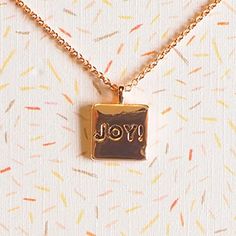 Keepsake Card Necklace make a thoughtful gift or an inspirational pick-me-up to remind yourself of God's love and faithfulness! Artfully crafted with a charm that beautifully represents the special message on the card. Gold plated brassSmall square charm inscribed with JOY!Lobster claw clasp16-18 adjustable chain3 x 5 Keepsake Card: I've got that JOY JOY JOY JOY down in my heart!Wipe Necklace with Soft Cloth as NeededFrom Kerusso's grace & truth® collectionPerfect to pin to a memo board or even Inspirational Charms Jewelry Gift, Inspirational Charms Jewelry As A Gift, Inspirational Charm Necklaces As Gift, Meaningful Gift Necklace, Inspirational Pendant Charm Necklace For Gift, Inspirational Pendant Charm Necklace As Gift, Meaningful Hand Stamped Charm Necklace Gift, Meaningful Rectangular Necklace For Gift, Meaningful Rectangular Necklaces For Gifts