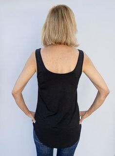 Take a look at our Black Rayon Modal Knit Tank Top Made out of a super soft rayon modal fabric Fabric content: 95% rayon modal, 5% spandex Color: Black Semi loose body with sides slightly shorter than front and back Straps are wide enough to wear a bra Round neck in front and back Back length is longer than front measuring at 21" Modal Tops With Built-in Bra For Loungewear, Casual Modal Tank Top With Built-in Bra, Black 4-way Stretch Tops For Spring, Stretch Modal Tank Top With Scoop Neck, Modal Stretch Tank Top For Loungewear, Stretch Modal Tank Top For Loungewear, Versatile Stretch Rayon Tops, Black Rayon Tops With Relaxed Fit, Versatile Black Rayon Tops