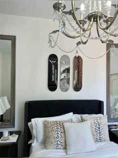 a bed room with a neatly made bed and two skateboards mounted to the wall