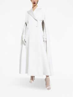 Find DOLCE & GABBANA Double-breasted Cape-design Maxi Coat on Editorialist. optical white virgin wool-silk blend satin finish cape design pleat detailing wide peak lapels double-breasted button fastening cut-out sleeves flared hem ankle-length Chic White Cape Outerwear, Chic White Winter Cape, Elegant White Cape With Cape Sleeves, Luxury Formal Cape, Elegant Long Sleeve Wool Cape, Embellished Coat, Cape Designs, Coat White, Maxi Coat