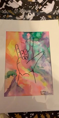 a painting with a hand drawn on it