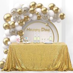 a table with champagne bottles and balloons on it for a happy day party or celebration