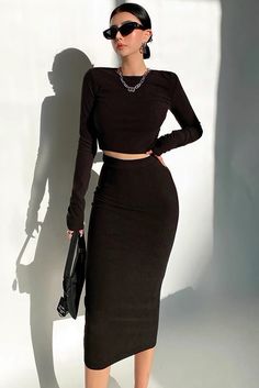 Item Type: TopMaterial: PolyesterPattern: SolidCollar: Round NeckSleeve Length: Long SleeveColor: Black. Brown. GraySize: S.M Size(cm) Clothing Length Bust Sleeve Length Skirt Length Waist Hip S 38 73+ 64 78 60+ 76+ M 39 77+ 65 79 64+ 80+ Trendy Cropped Fitted Skirt, Trendy Fitted Cropped Skirt, Fitted Black Two-piece Skirt, Chic Black Two-piece Dress, Black Two-piece Dress For Party, Black Two-piece Party Dresses, Casual Fitted Two-piece Skirt Set, Elegant Black Two-piece Skirt, Elegant Two-piece Black Skirt