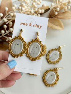 a pair of earrings that have been placed next to each other