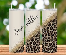 two personalized tumbles with leopard print on them