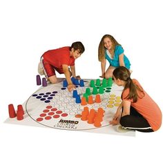 two children playing a board game on the floor