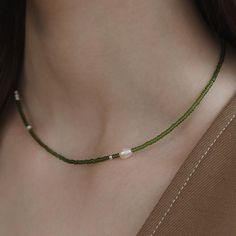 Pearl Solitaire Beaded Necklace with 925 Silver Beads,Olive Green Beaded Necklace,Minimalist Beaded Choker,Boho Jewelry,Handmade Jewelry,Gift for Her (NZ2444) ▶ Product Info. - Material: 925 Sterling Silver / Freshwater Pearl / Cubic Zirconia  - Metal Finish: Silver + Anti-Tarnish E-Coat  - Safety: Nickle & Lead free and Haypoallergenic - Length: 38cm + 5cm (length adjustable) - Weight: 3.43g - TATIANA & Silver 925 engraved tag was added. - Made In South Korea Our jewelry was plated with a high-content gold/silver layer to minimize the discoloration, compared to regular non-plating one. ▶ Shipping and Return Policies Order today to get by  Date (14days) Return & exchanges accepted within 30days Cost to ship : USD 7.00 ▶ Cancellations Cancellations : accepted Request a cancellation : before Choker Handmade, Green Beaded Necklace, Boho Choker, Handmade Gifts For Her, Vert Olive, Handmade Jewelry Gift, Necklace Minimalist, Jewelry Cleaner, Beaded Choker