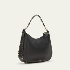 Valentino Garavani hobo bag in calfskin leather with Rockstud trim  Detachable shoulder strap  Zip top closure  Interior, one slip pocket  Approx. 11"H x 14.1"W x 2.3"D Made in Italy Evening Hobo Bag With Gunmetal Hardware In Satchel Shape, Luxury Hobo Shoulder Bag With Gunmetal Hardware, Luxury Formal Hobo Bag With Gunmetal Hardware, Luxury Hobo Bag With Gunmetal Hardware For Formal Events, Luxury Crossbody Hobo Bag With Gunmetal Hardware, Luxury Hobo Bag With Gunmetal Hardware Crossbody, Luxury Hobo Bag With Gold-tone Hardware For Errands, Studded Crossbody Bags For Everyday Use, Everyday Crossbody Bags With Studs