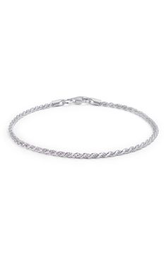 A sterling silver bracelet features a twisted rope design for textural flair. 7" length Clasp closure Sterling silver Imported Elegant Silver Braided Bracelet With Lobster Clasp, Classic Silver Twisted Jewelry, Classic Twisted Silver Jewelry, Silver Chain Link Jewelry With Rope Chain, Silver Rope Chain Link Jewelry, Silver Tennis Bracelet With Chain Link, Silver Jewelry With Rope Chain Link, Silver Rope Chain Jewelry, Silver Chain Link Jubilee Tennis Bracelet