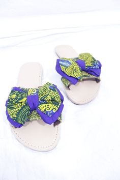 "African materials  are known for bold, unique and friendly colours. These sandals are hand  made. They are made from Ankara(cotton). They are neatly, quality and stylish made.These are perfect as a gift. Shoe Size:UK 5  Main Colour:Yellow Brand:Unbranded  Upper Material:Cotton Style:Flip Flops Heel Height:Flat (less than 0.5\") EU Shoe Size:38 Occasion:Casual" Casual Adjustable Sandals, Fabric Sandals For Vacation, Flat Fabric Sandals For Vacation, Casual Fabric Beach Sandals, Casual Fabric Sandals For Beach, Casual Beach Sandals In Fabric, Adjustable Fabric Sandals For Summer, Handmade Green Sandals For Summer, Adjustable Fabric Sandals With Open Toe