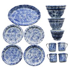 blue and white dinnerware set with matching cups