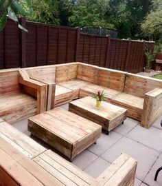 an outdoor seating area made out of wooden pallets