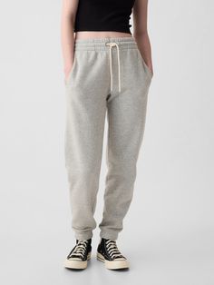 Soft knit joggers.  Elasticized waist with drawcords.  Front slant pockets.  Banded, elasticized cuffs.  These joggers are made with 23% recycled polyester.  Less waste in the world.  More great clothes for you.  Mid rise.  Easy through the hip and thigh.  Skinny leg opening.  Skims the ankle.