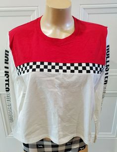 Description: This is a super stretchy long-sleeve jersey t-shirt for women.  It is color block with the Hollister logo down the arms and a short wide design.   Brand: Hollister Style: Long-Sleeve Tee Material: 100% Cotton Color: Black, Red and Cream Size: Medium Condition: New with Tags  Thank you for looking. We have lots of great items in our store and are always happy to combine shipping!  Click on the image below to see our other items. Hollister Logo, Hollister Style, Long Sleeve Jersey, White Long Sleeve, Active Wear Tops, Hollister, Color Block, Long Sleeve Tees, Red And White