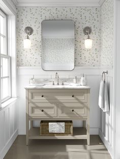 a white bathroom with two sinks and a large mirror above the sink, in front of a window