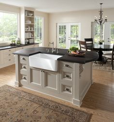 a large kitchen with an island and sink