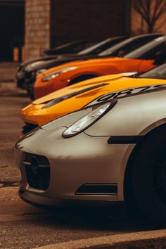 Line up at a car meet in downtown Indianapolis. A grey Porche, then a yellow and orange car, with two black cars in the background. Multiple Cars Photography, Car Style Photography, Cars Lined Up, Two Cars Photography, Classic Car Pictures, Sport Car Photography, Sport Car Photoshoot, Car Photography Composition, Professional Car Photography