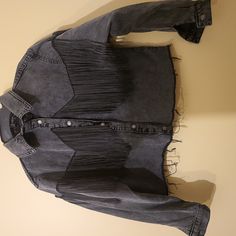 Women Denim Jacket Featuring Long Fringe Trim Down Long Sleeves And Back,Buttoned Down Front. Size 6 Never Worn . Trendy Fall Denim Top With Frayed Hem, Trendy Frayed Hem Denim Top For Fall, Black Denim Outerwear With Frayed Hem, Fall Dark Wash Long Sleeve Cropped Jacket, Fall Long Sleeve Dark Wash Cropped Jacket, Long Sleeve Denim Rodeo Outerwear, Fall Rodeo Denim Jacket, Spring Rodeo Dark Wash Denim Jacket, Long Sleeve Grunge Outerwear With Frayed Hem