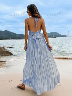 Color : BlueStyle : BohoDetails : Backless, Split ThighType : CamiPattern Type : Plain, StripedSleeve Length : SleevelessNeckline : HalterWaist Line : High WaistHem Shaped : SlitLength : LongFit Type : Slim FitFabric : Non-StretchMaterial : FabricComposition : 100% PolyesterCare Instructions : Machine wash, do not dry cleanSheer : No Size US Bust Length Straps Length Waist Size S 4 36.2 48.8 32.3 26.8-41.7 M 6 37.8 49.2 32.5 28.3-43.3 L 8/10 40.2 49.6 32.8 30.7-45.7 XL 12 42.5 50 33.1 33.1-48 Blue Spaghetti Strap Halter Dress For Spring, Sleeveless Tie Back Halter Dress For Beach Season, Blue Summer Halter Dress For Beach Season, Blue Backless Halter Dress For The Beach, Light Blue V-neck Maxi Dress For Beach, Backless Halter Sundress For Beach Season, Backless Tie-back Halter Dress For Beach, Backless Halter Dress With Tie Back For Beach, Blue Beach Sundress Halter Dress