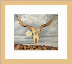 an animal skull with long horns and a flower in it's mouth on a cloudy day