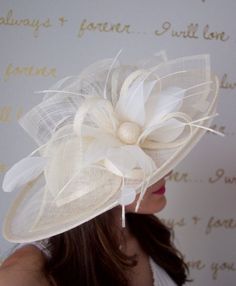 Soak up the sun in the chicest, vintage-styled sun hat. This hat has a slightly flipped brim silhouette, large mesh petals that make a statement not to be messed with and topped off with a delicate feather flower. This glam style features day-to-dark versatility for the perfect derby queen look!Looking for fascinators to choose from, shop Here:http://www.etsy.com/shop/EyeHeartMe?section_id=12490116Add a matching shawl or scarf, shop Here:http://www.etsy.com/shop/EyeHeartMe?section_id=12527888Mos Unique Fascinators, Mesh Flowers, Flowers And Feathers, Feather Extensions, Scarf Shop, Kentucky Derby Hats, Feather Flower, Mesh Hat, Glam Style