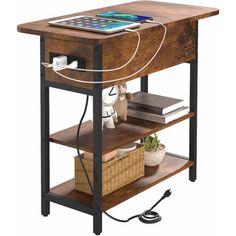 an electronic device is plugged in to a wooden table with shelves on both sides