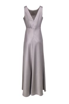 Be a stunner at your next formal event in this Sachin & Babi grey satin sleeveless dress. This stunning gown features a sleek grey maxi design, perfect for any formal occasion. Add some sparkle with statement silver earrings and complete the look with strappy sandal heels. Get ready for a night of elegance and glamour. Size 8 100% Polyester Fully lined Invisible zipper back Sleeveless Low back Bust 38" Waist 30" Shoulder to hem 62.5" Sleeveless Formal Evening Maxi Dress, Formal Sleeveless Maxi Dress For Evening, Formal Sleeveless Evening Maxi Dress, Maxi Length Satin Dress For Prom Season, Elegant Sleeveless Satin Maxi Dress, Formal Satin Maxi Dress For Prom Season, Sleeveless Satin Formal Evening Dress, Formal Satin Maxi Dress, Maxi Satin Dress For Prom Season