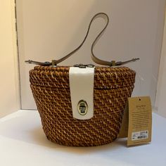 Reminiscent Of Summer Holidays And 1950s Movies, Our Handmade Woven Natural Basket Bag Features White Leather Trim. A Perfect Accompaniment To Breezy Summer Looks, This Lovely Vintage Bag Has A Texture And Patina That Are Hard To Resist Adding A Bohemian Flair To Casual Looks And A Chic Edge To Your Warm Weather Wardrobe. Details Leather Trim Accents Interior: Zip Pocket, Two Slip Pockets, Fully Lined In Faux Suede White Straw Bag With Top Carry Handle For Vacation, White Handheld Bucket Bag With Top Carry Handle, Classic White Bucket Bag With Leather Handles, White Straw Bag With Top Carry Handle, Classic Summer Satchel Shoulder Bag, Classic Satchel Shoulder Bag For Summer, Summer White Bucket Bag With Top Carry Handle, White Bucket Bag With Top Carry Handle For Summer, White Summer Bucket Bag With Top Handle