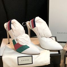 Gucci Sylvie White Leather Slingback Heels New In Box -Condition: Brand New Item With Original Box + Dust Bags + Gucci Card. -All Of Our Items Are 100% Authentic. -Size: Eu 39 (True To Size). -Color: White. -Model: Sylvie. -Code: 525146 -Calfskin Leather Upper. -Web Slingback Pumps With Green And Red Glitter Stripes. -Elastic Strap. -Covered Heel Measures Approx. 4" (100mm). -Leather Lining; Leather Soles. -Made In Italy. -Retails For $950.00 Designer White Slingback Pumps For Evening, Designer White Slingback Pumps With Heel Strap, White Designer Slingback Pumps With Pointed Toe, Designer White Slingback Heels, Luxury White Slingback Pumps, Designer White Leather Slingback Pumps, Designer White Pointed Toe Slingback Pumps, White Leather Slingback Pumps With 4-inch Heel, Elegant White Slingback Pumps With 4-inch Heel