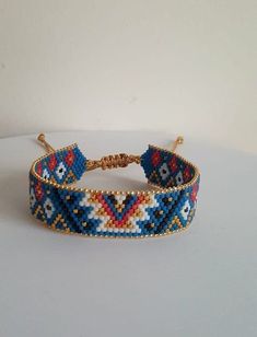 a beaded bracelet on a white surface