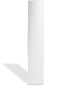 a tall white vase sitting on top of a table