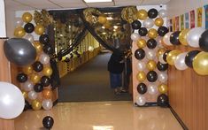 a hallway decorated with balloons and streamers