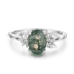 Magical, otherworldly, enchanting. Our Enchanted Garden Moss Agate Ring© has earned its name with a stunning oval-cut moss agate center stone adorned with clusters of round gems in a twisted band. May this piece allow you to spread the seeds of happiness and cultivate a life you love. ✦ Available in both 14K white gold vermeil (14K white gold plated over a sterling silver base) and 10K solid white gold. Bff Rings, Oval Moissanite Ring, Moss Agate Ring, Twisted Band, Enchanted Garden, Agate Ring, Agate Necklace, Shop Engagement Rings, Moonstone Ring