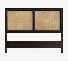 the headboard is made out of wood and has two panels on each side, with woven