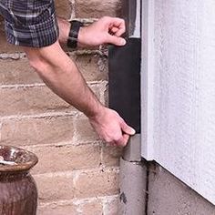 a man is opening the window with his hand