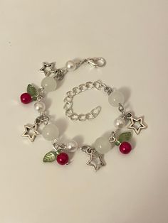 'Very Berry' is a handmade charm bracelet, with a range of different beads, from white glass to green leaves!  The VB bracelet is decorated with dangling star charms, and adjustable to fit all wrists.  Perfect for friends, family, stocking fillers, secret santa, and more! White Beaded Bracelets With Charms For Jewelry Making, Christmas Chain, Unique Stockings, Handmade Charm Bracelets, Dainty Jewellery, Strawberry Charm, Bracelet Inspo, Bead Diy, Diy Jewelry Unique