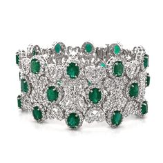 Vintage Art Deco inspired diamond white gold bracelet. Adorned with 30 Zambian oval cut emeralds 22.18 carat total. Accented with white round cut diamonds 20.16 carat total. Diamonds are all natural in G-H Color Clarity VS. 18 karat white gold bracelet in a wide cuff design. Length: 18 cm Width. 3 cm Weight: 88 g This item is spoken for. Please contact info@maxjewelryinc.com to request for an equal or similar item. [shortcode] [video] [/video] [/shortcode] Halo Bracelet, Argentium Silver Jewelry, Platinum Bracelet, Retro Bracelet, Platinum Earrings, Modern Bracelets, Antique Bracelets, White Gold Set, Bracelets Gold Diamond