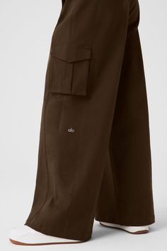 A cross between cargos and trousers, these pants are designed with exaggerated wide legs, cool cargo pockets and front zipper pockets. They’re made from a heavyweight, drapey cotton blend that looks put-together yet feels comfortable. The Show Off hits high on the waist (perfect for pairing with crop tops) with a tailored front and a stretchy back (for a fuss-free fit every time). Alo Yoga Relaxed Fit Wide Leg Bottoms, Casual Alo Yoga Pants For Work, Alo Yoga Relaxed Fit Pants With Pockets, Alo Yoga Pants With Pockets, Utility Wide Leg Cotton Pants With Side Pockets, Oversized Wide Leg Cargo Pants With Pockets, Oversized Wide Leg Cargo Jeans With Pockets, Utility Cotton Wide Leg Pants With Side Pockets, Utility Style Cotton Wide Leg Pants With Side Pockets