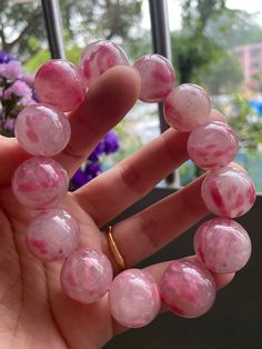 Material:pink rhodonite beads  size :Approx 17mm Top beads 19mm   quantity: one strand  6mm approx 29 pcs one strands 7mm approx25 pcs one strands 8mm approx 22 pcs one strands 9mm approx 21pcs one strands 10mm approx 19 pcs one strands 11mm approx 18pcs one strands 12mm approx 16 pcs one strands 13mm approx 16 pcs one strands 14mm approx 15 pcs one strands 15mm approx 14pcs one strands 16mm approx 14 pcs one strands 17mm approx 13pcs one strands 18mm approx 13pcs one strands 19mm approx 12pcs o Pink Rose Quartz Round Beaded Bracelets, Pink Crystal Bracelet With Natural Round Beads, Pink Natural Stones Crystal Bracelet, Pink Crystal Bracelet With Natural Stones, Pink Crystal Gemstone Bracelet, Pink Crystal Bracelet With Round Natural Stones, Pink Gemstone Crystal Bracelet, Pink Round Crystal Gemstone Bracelet, Pink Beaded Jewelry With 8mm Round Beads