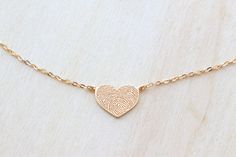 "This fingerprint jewelry heart necklace is a perfect keepsake for girlfriends, wives, mums and grandmothers and makes a unique and very personalized gift. HOW TO ORDER - When you make an order, please send us a picture of the fingerprint and handwriting via Etsy Conversation (click \"Attach Image\" to attach your photo). Or email it to janesilverjewelry [!at] gmail.com and we will take care of the rest. You may use your phone, camera, or scanner to capture the picture. - Use the best quality yo Hand Stamped Heart Pendant Necklace For Keepsake, Hand Stamped Heart Pendant Necklace For Gift, Hand Stamped Heart Pendant Necklace Gift, Hand Stamped Heart Necklace Gift, Keepsake Hand Stamped Heart Pendant Necklace, Hand Stamped Jewelry For Valentine's Day Keepsake, Stamped Jewelry For Valentine's Day Gift, Minimalist Jewelry For Valentine's Day Keepsake, Minimalist Keepsake Jewelry For Valentine's Day