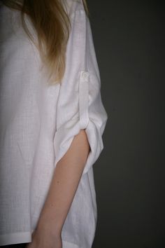 "That very comfy and airy style shirt. Very loose simple shirt with 4 buttons closure at front, oval form neck and long sleeves - with the strap inside - for keeping folded sleeve cuff and closed with button. You will feel very free and comfortable in this eco friendly shirt , which you can wear in every day, go for holiday, garden... As always this shirt is available in my shop - in both eco colors - natural not dyed linen and white. This shirt I propose in three sizes - S, M and L. Size S bust Casual White Linen Blouse, White Blouse With Rolled Sleeves In Relaxed Fit, White Relaxed Fit Blouse With Rolled Sleeves, White Tops With Roll-up Sleeves For Everyday, Casual White Shirt With Cuffed Sleeves, White Linen Blouse With Button Cuffs, White Linen Tops With Rolled Sleeves, Oversized Linen Top With Roll-up Sleeves, White Linen Top With Rolled Sleeves