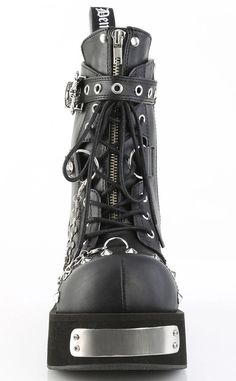 The Dank lace-up shoes are the chunkiest boys, featuring metal plates and a skull buckle, these are the dankest kicks to go in! Vegan Black PU leather 3 1/4 inch platform Front & Back Metal Plated Platform Lace-up Featuring Eyeletted Skull Head Buckle Strap, Metal Cone Studded Details on the Toe and Heel, Ornamental Zipper on Tongue, D-Ring & Hanging Chain Details U.S women's sizing-refer to size chart for more info Chunky Ankle Boots, Demonia Shoes, Metal Plates, Skull Head, Black Vegan, Perfect Shoes, D Ring, Leather Ankle Boots, Lace Up Shoes