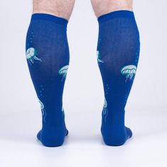 Dive into nautical bliss with our Nice to Sea You knee-high socks! Featuring a delightful all-over pattern of jellyfish in white with green and blue accents on a baby blue background, these socks will make a splash wherever you go. Perfect for men and women with wide calves, these socks bring a touch of marine magic to your wardrobe. From pool parties to beachy getaways, these socks are sure to be the catch of the day.! Casual Blue Knee-high Socks, Fitted Blue Knee-high Socks, Baby Blue Background, Sock Lovers, Calf Socks, Wide Calf, Knee High Socks, Novelty Socks, Men Shoes Size