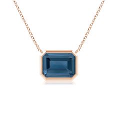 This classic east west London blue topaz pendant is crafted in 14k rose gold. The emerald cut greenish blue gemstone is mounted in a horizontal bezel setting. Pendant Ideas, Blue Topaz Pendant, Topaz Pendant, Greenish Blue, West London, London Blue Topaz, Blue Gemstones, East West, London Blue