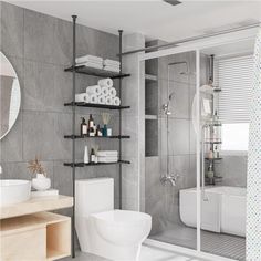 a white toilet sitting next to a bath tub under a bathroom mirror on top of a wooden shelf